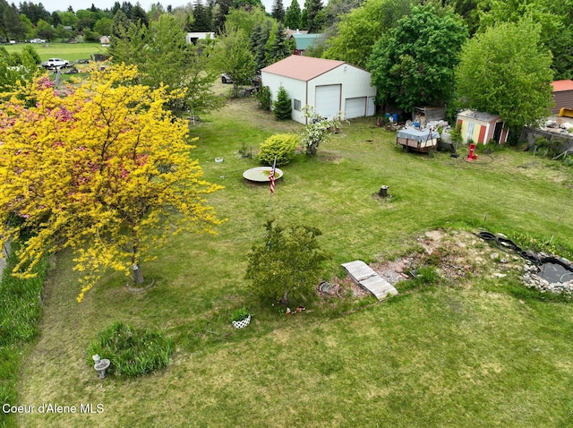 8705 N Ramsey Rd, Hayden, ID 83835 - view of grassy yard featuring a detached garage
