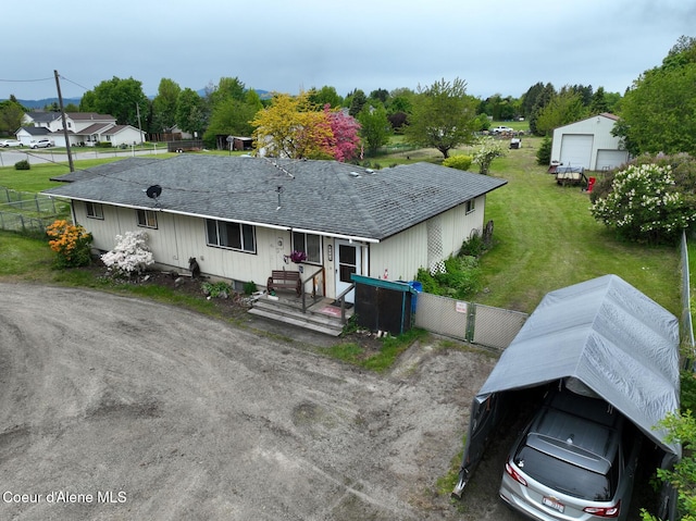 8705 N Ramsey Rd, Hayden, ID 83835 - view of front facade with a shingled roof and a garage