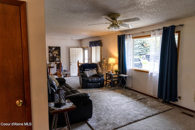 8705 N Ramsey Rd, Hayden, ID 83835 - living room featuring carpet flooring, ceiling fan, a textured ceiling, and baseboards