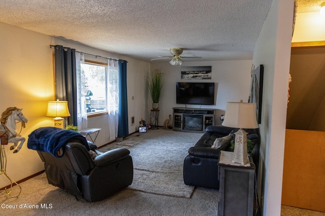 8705 N Ramsey Rd, Hayden, ID 83835 - carpeted living area with a textured ceiling, a ceiling fan, and baseboards