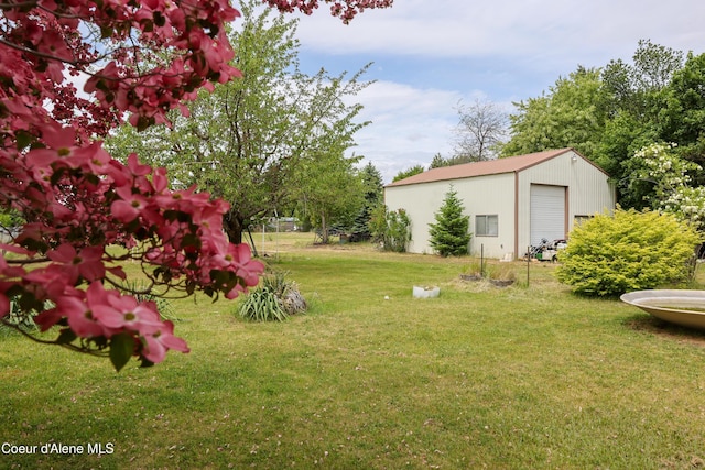8705 N Ramsey Rd, Hayden, ID 83835 - view of green lawn with an outbuilding and a garage