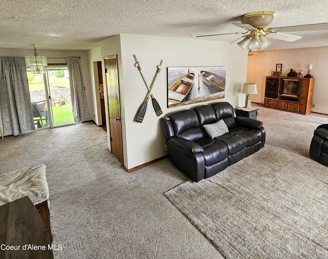 8705 N Ramsey Rd, Hayden, ID 83835 - living room with carpet flooring, ceiling fan, a textured ceiling, and baseboards