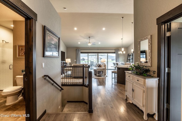 14441 N Pristine Cir, Rathdrum, ID 83858 - kitchen with a textured wall, dark wood-type flooring, white cabinets, ceiling fan, and open floor plan