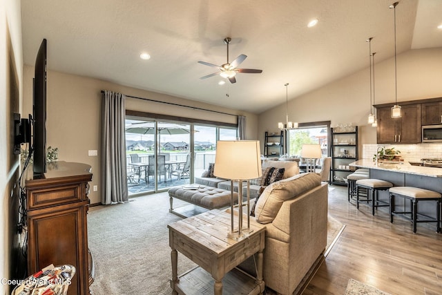 14441 N Pristine Cir, Rathdrum, ID 83858 - living area with a ceiling fan, recessed lighting, a chandelier, light wood finished floors, and high vaulted ceiling