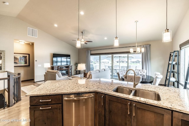 14441 N Pristine Cir, Rathdrum, ID 83858 - kitchen featuring a sink, dishwasher, vaulted ceiling, dark brown cabinetry, and open floor plan