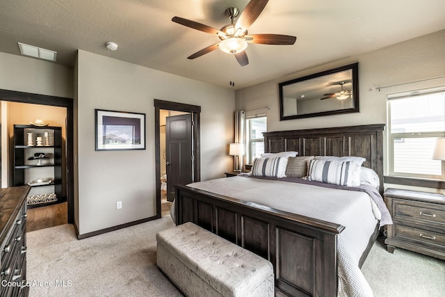 14441 N Pristine Cir, Rathdrum, ID 83858 - bedroom featuring light colored carpet, baseboards, and a ceiling fan