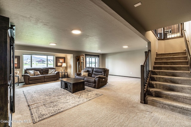 14441 N Pristine Cir, Rathdrum, ID 83858 - carpeted living room with stairs, recessed lighting, a textured ceiling, and baseboards