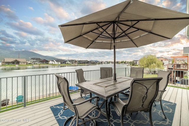 14441 N Pristine Cir, Rathdrum, ID 83858 - wooden deck featuring outdoor dining area, a water view, and a residential view