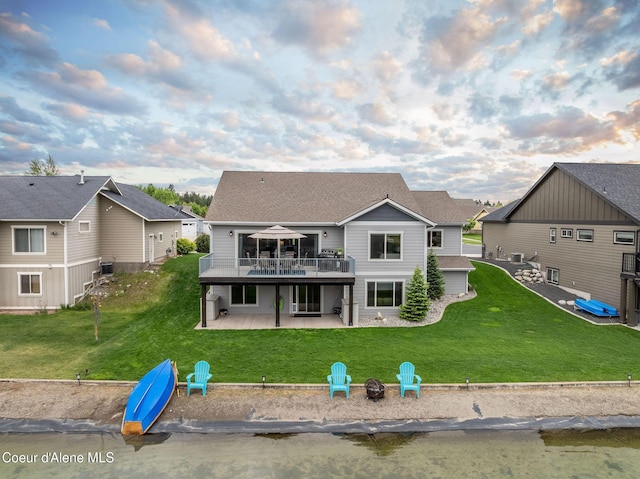 14441 N Pristine Cir, Rathdrum, ID 83858 - back of house with an outdoor fire pit, a patio, a yard, a deck, and a residential view