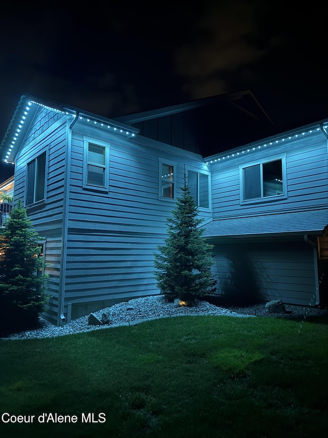 14441 N Pristine Cir, Rathdrum, ID 83858 - property exterior at night with a lawn