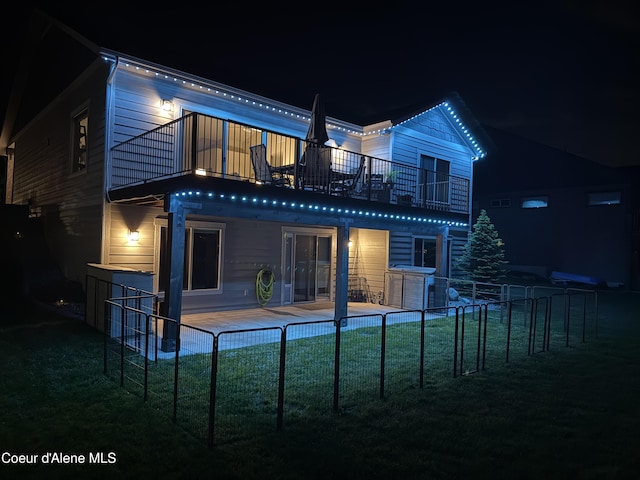 14441 N Pristine Cir, Rathdrum, ID 83858 - back of house at night with a balcony
