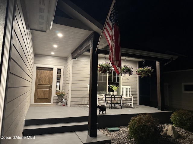 14441 N Pristine Cir, Rathdrum, ID 83858 - doorway to property featuring covered porch