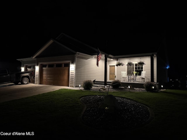 14441 N Pristine Cir, Rathdrum, ID 83858 - single story home with a porch, concrete driveway, a lawn, and an attached garage