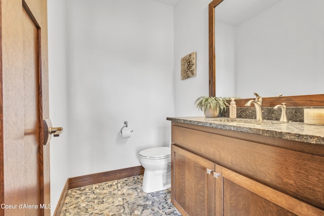 4618 S Scenic Dr, Coeur Dalene, ID 83814 - half bathroom featuring vanity, toilet, and baseboards
