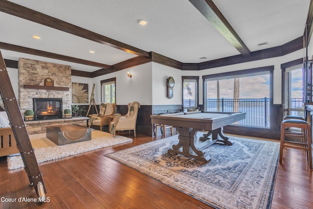 4618 S Scenic Dr, Coeur Dalene, ID 83814 - recreation room with beam ceiling, wainscoting, pool table, a fireplace, and hardwood / wood-style flooring