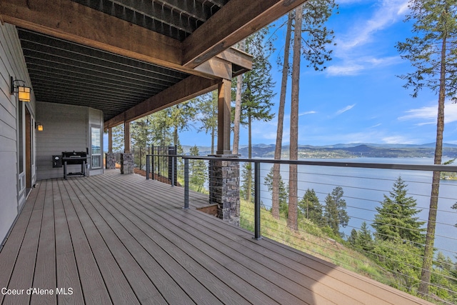 4618 S Scenic Dr, Coeur Dalene, ID 83814 - wooden deck with a water and mountain view and grilling area