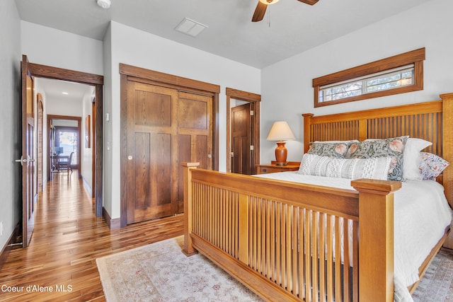 4618 S Scenic Dr, Coeur Dalene, ID 83814 - bedroom featuring multiple windows, wood finished floors, ceiling fan, and a closet