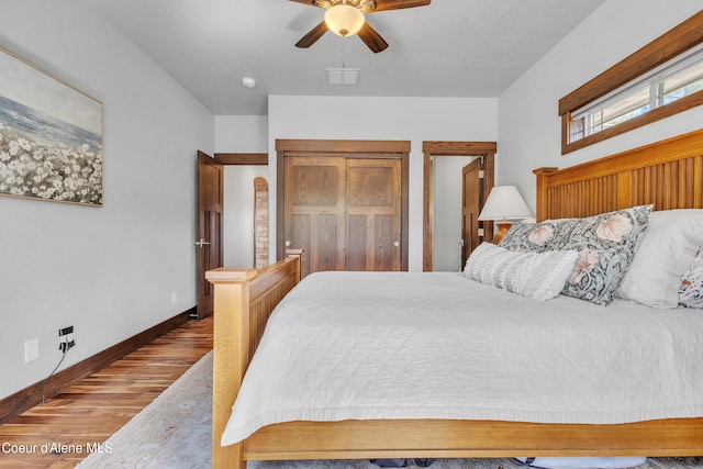 4618 S Scenic Dr, Coeur Dalene, ID 83814 - bedroom featuring wood finished floors, baseboards, and ceiling fan