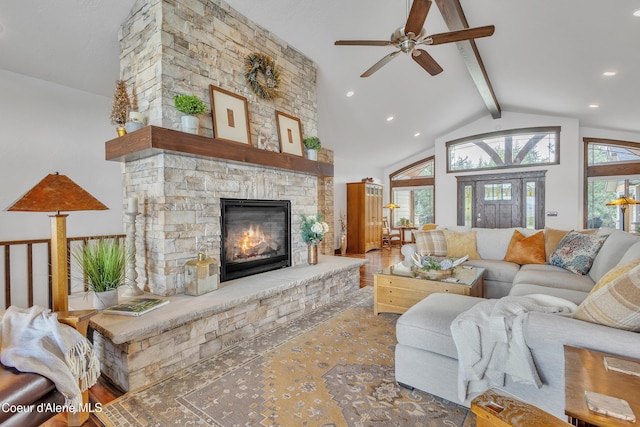 4618 S Scenic Dr, Coeur Dalene, ID 83814 - living room featuring healthy amount of natural light, ceiling fan, beam ceiling, a stone fireplace, and recessed lighting
