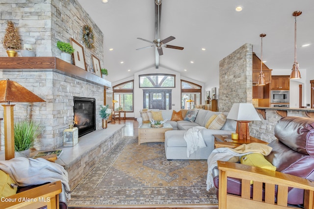 4618 S Scenic Dr, Coeur Dalene, ID 83814 - living area featuring a fireplace, a ceiling fan, vaulted ceiling, and recessed lighting