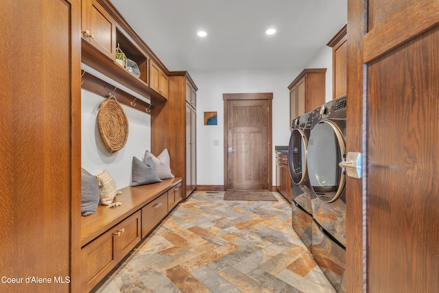 4618 S Scenic Dr, Coeur Dalene, ID 83814 - laundry room featuring cabinet space, independent washer and dryer, stone tile flooring, recessed lighting, and baseboards