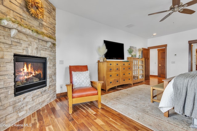 4618 S Scenic Dr, Coeur Dalene, ID 83814 - bedroom featuring wood finished floors, a fireplace, recessed lighting, and ceiling fan