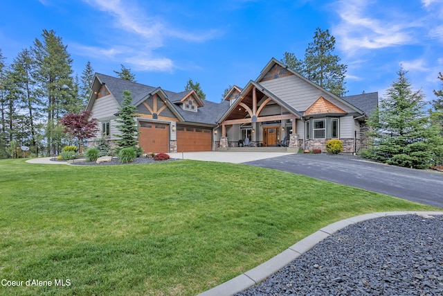 4618 S Scenic Dr, Coeur Dalene, ID 83814 - craftsman house with stone siding, asphalt driveway, an attached garage, a front lawn, and a shingled roof