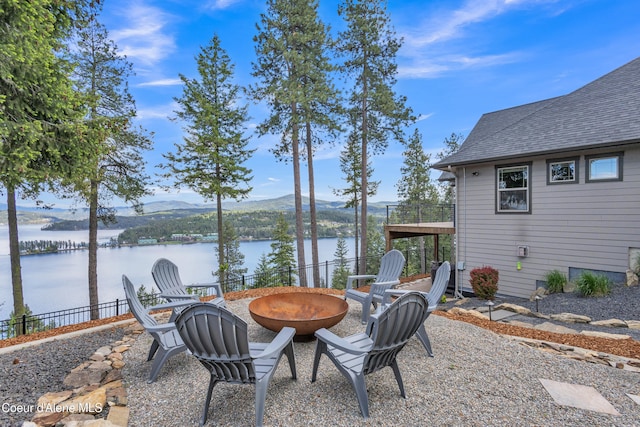 4618 S Scenic Dr, Coeur Dalene, ID 83814 - view of yard featuring a fire pit and a water and mountain view