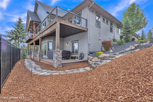 4618 S Scenic Dr, Coeur Dalene, ID 83814 - rear view of house with a patio area, a fenced backyard, and a deck