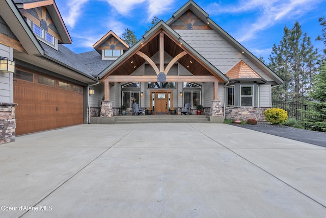 4618 S Scenic Dr, Coeur Dalene, ID 83814 - craftsman-style house featuring a porch, stone siding, and concrete driveway
