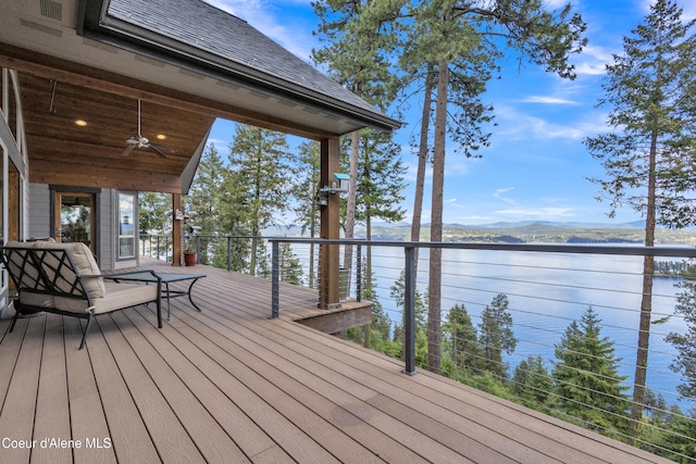 4618 S Scenic Dr, Coeur Dalene, ID 83814 - deck featuring a water and mountain view and a ceiling fan