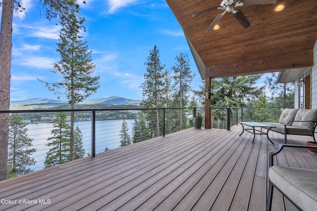 4618 S Scenic Dr, Coeur Dalene, ID 83814 - wooden terrace featuring a water and mountain view and ceiling fan