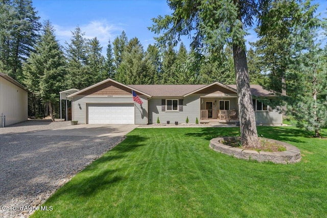 23815 N Rapalla Ct, Athol, ID 83801 - ranch-style home featuring a garage, driveway, a front yard, and covered porch