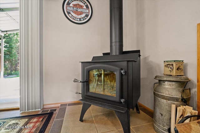 23815 N Rapalla Ct, Athol, ID 83801 - detailed view of a wood stove and baseboards