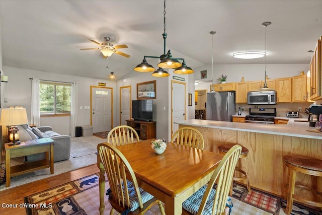 23815 N Rapalla Ct, Athol, ID 83801 - dining space with vaulted ceiling, ceiling fan, and light wood-type flooring