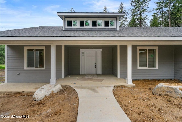 10233 Bunco Rd, Athol, ID 83801 - view of front of house with covered porch and a shingled roof