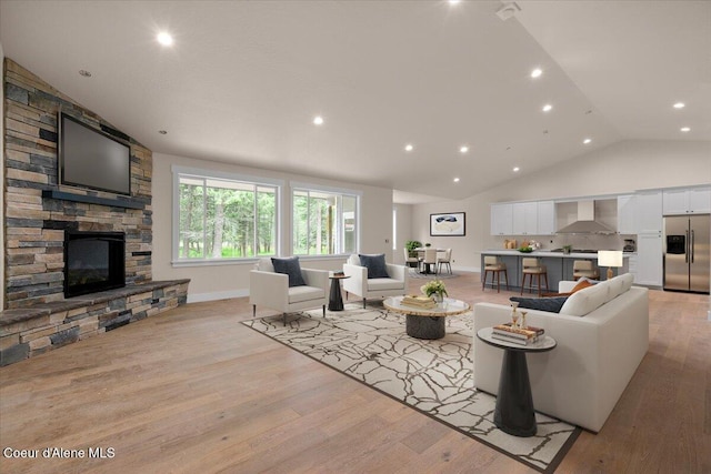 10233 Bunco Rd, Athol, ID 83801 - living room featuring a fireplace, light wood-style floors, high vaulted ceiling, recessed lighting, and baseboards