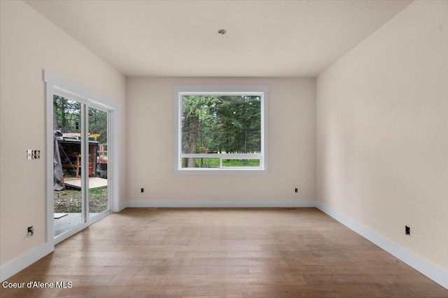 10233 Bunco Rd, Athol, ID 83801 - unfurnished room featuring wood finished floors and baseboards