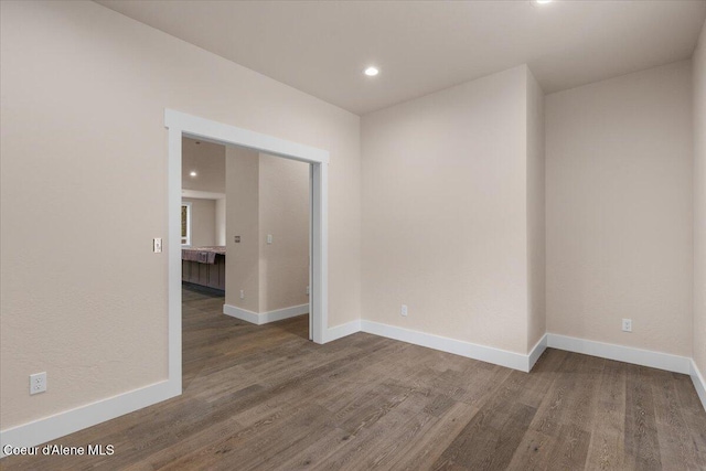 10233 Bunco Rd, Athol, ID 83801 - unfurnished room featuring wood finished floors, baseboards, and recessed lighting