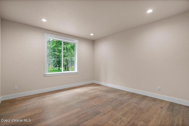 10233 Bunco Rd, Athol, ID 83801 - unfurnished room featuring light wood-style flooring, baseboards, and recessed lighting