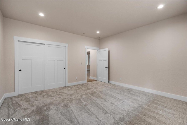 10233 Bunco Rd, Athol, ID 83801 - unfurnished bedroom with carpet flooring, recessed lighting, baseboards, and a closet