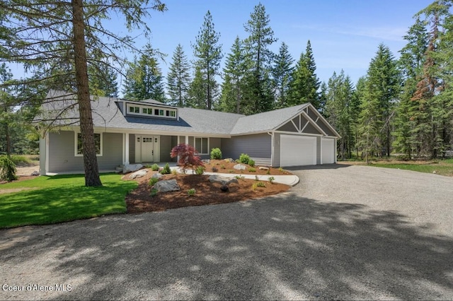 10233 Bunco Rd, Athol, ID 83801 - view of front of property featuring driveway, an attached garage, and a front lawn