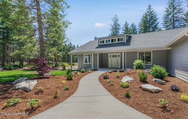10233 Bunco Rd, Athol, ID 83801 - view of front facade featuring a porch and a shingled roof