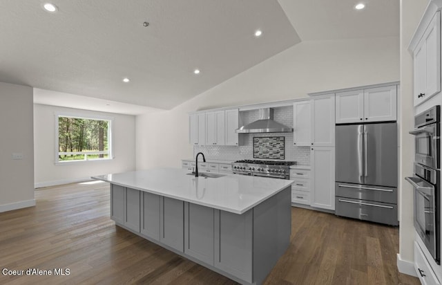 10233 Bunco Rd, Athol, ID 83801 - kitchen featuring high quality appliances, decorative backsplash, lofted ceiling, dark wood-style flooring, and wall chimney exhaust hood