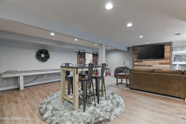 5030 E Frazier Dr, Post Falls, ID 83854 - dining space featuring wood finished floors, recessed lighting, baseboards, and a barn door