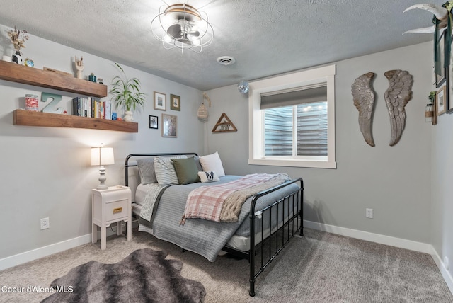 5030 E Frazier Dr, Post Falls, ID 83854 - carpeted bedroom featuring a textured ceiling and baseboards