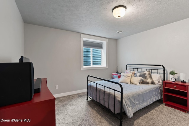 5030 E Frazier Dr, Post Falls, ID 83854 - bedroom featuring carpet, a textured ceiling, and baseboards