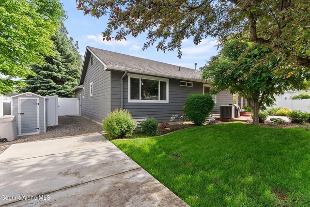 5030 E Frazier Dr, Post Falls, ID 83854 - view of front of property with a shingled roof and central AC