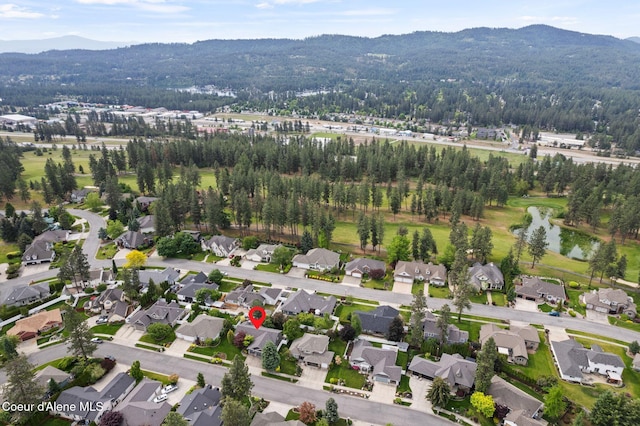 5030 E Frazier Dr, Post Falls, ID 83854 - aerial view of property's location with a water and mountain view and nearby suburban area