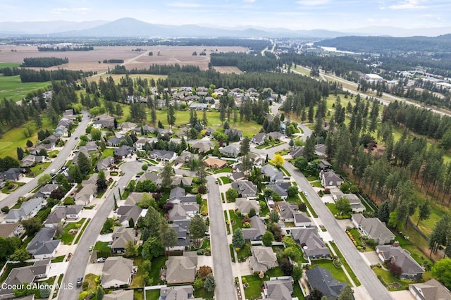 5030 E Frazier Dr, Post Falls, ID 83854 - aerial overview of property's location featuring a mountain backdrop and nearby suburban area